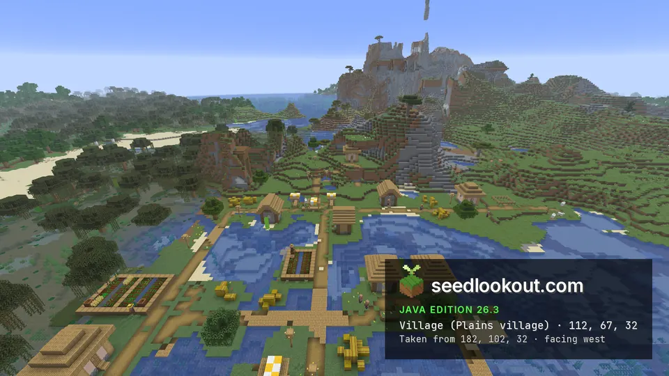 Plains village houses and wooden paths at the water edge below steep stone cliffs and narrow rock spires