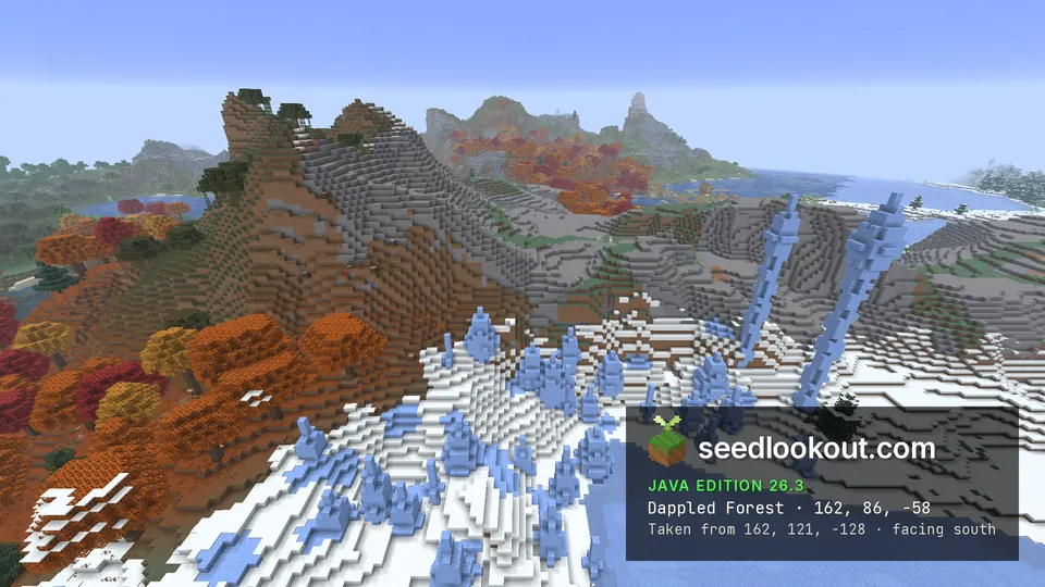 Red and orange dappled forest beside snowy ground, blue ice spikes and exposed stone hills