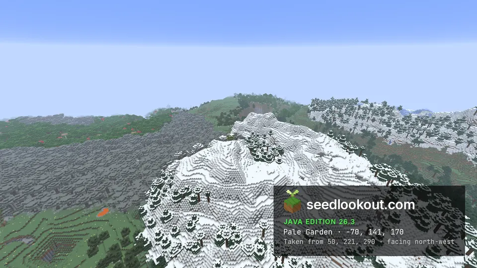 Wide view of gray pale garden trees, snow-covered hills and a green valley below the ridge