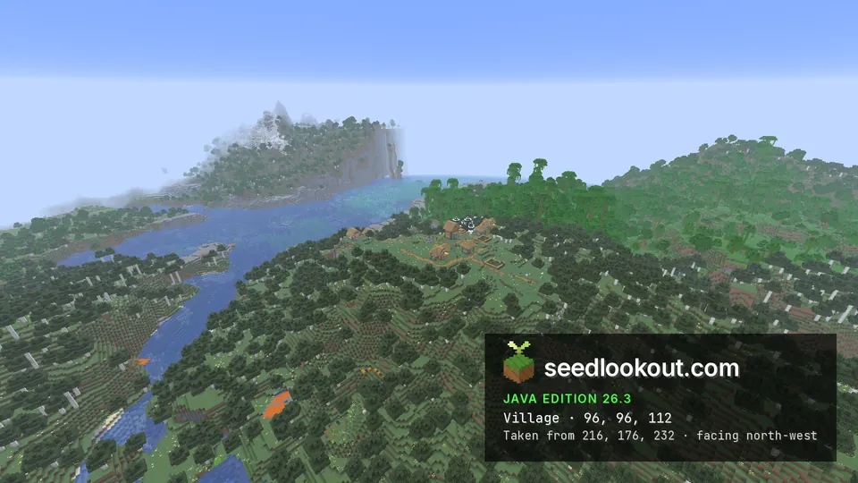 Wide view of the village on a wooded hill, with the bay and a misty mountain beyond
