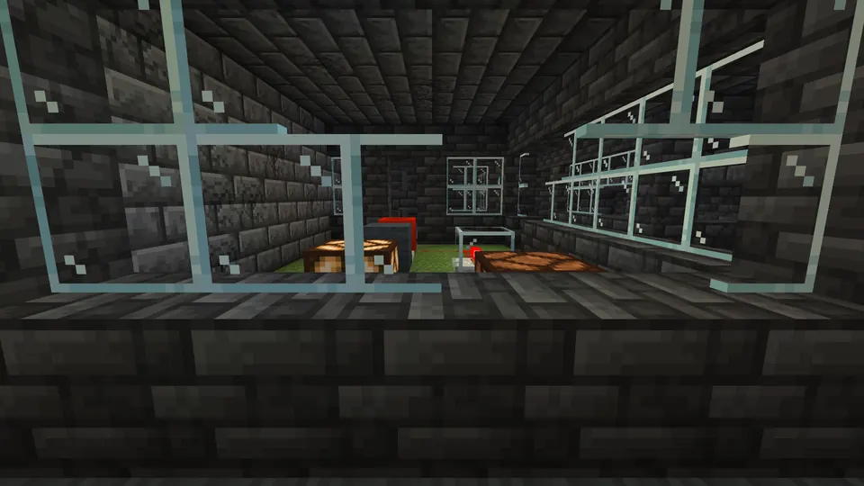 Deepslate brick room seen through glass panes, with a moss floor inside
