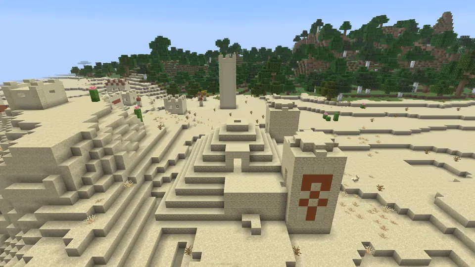 Sandstone steps and the orange terracotta towers of a desert pyramid