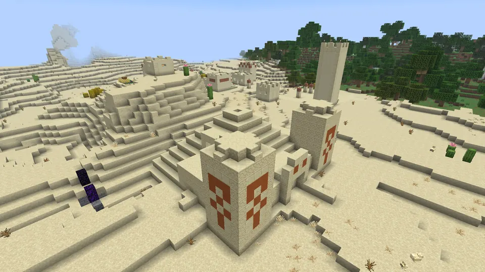 Sandstone towers and patterned entrance of a desert pyramid