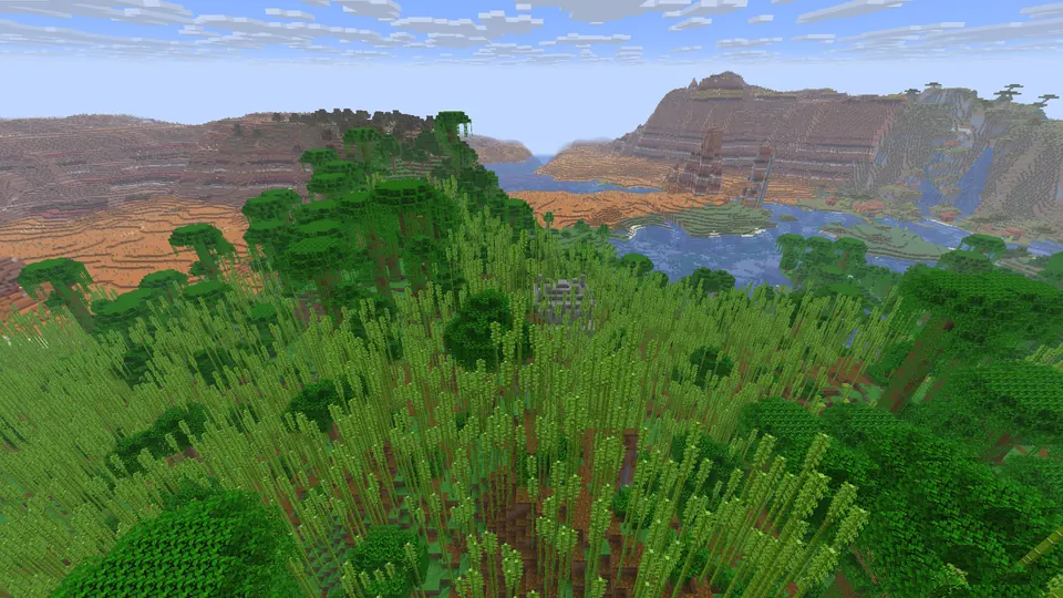 Bamboo jungle with a small grey temple in the middle, a lake and red badlands mesas beyond