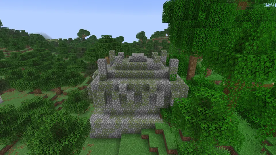 The mossy cobblestone steps and walls of a jungle pyramid among jungle trees