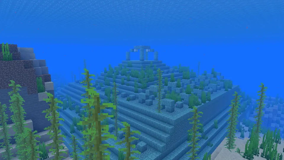 Closer side view of an ocean monument beneath the water