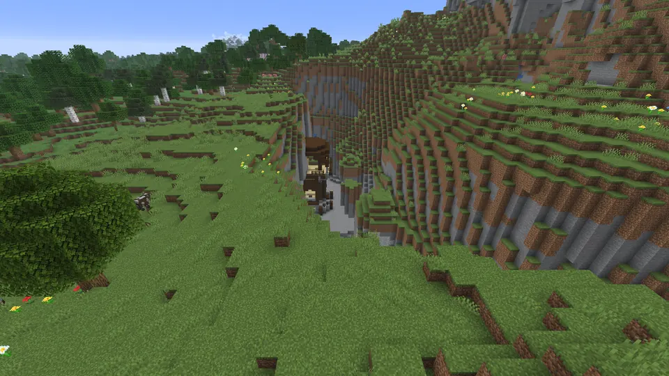 Pillager outpost tower clearly visible down a narrow steep-sided cleft