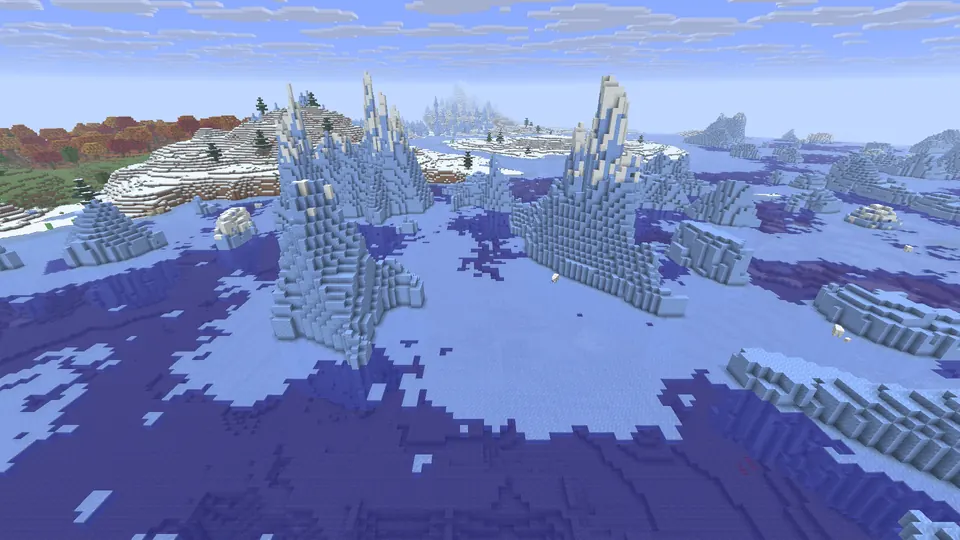 Tall pale blue icebergs rising from a frozen ocean, a snowy shore and red trees in the distance