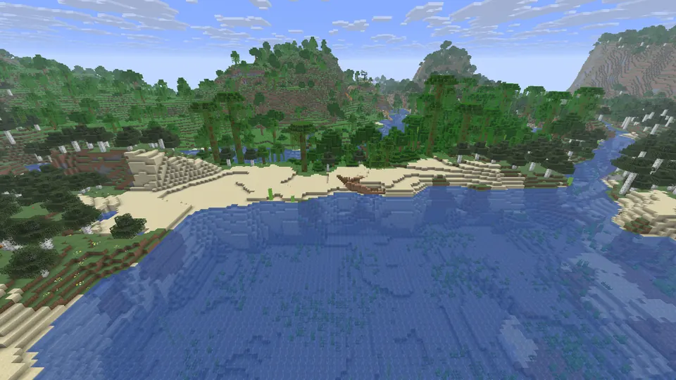Wooden shipwreck on a sandy beach at the edge of a blue bay, jungle trees and forested hills behind