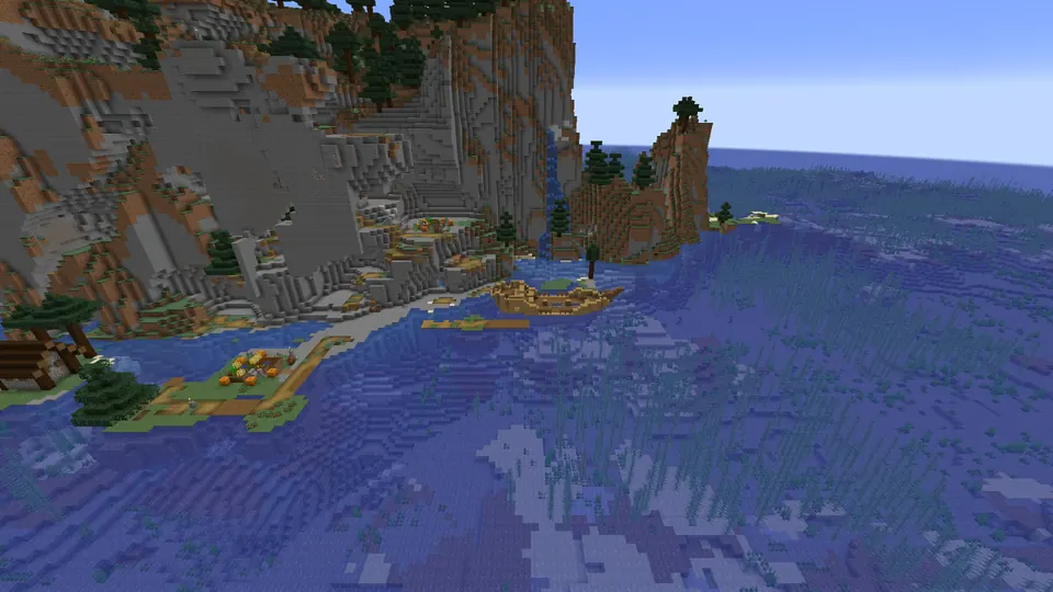 Wooden shipwreck in shallow water below grey cliffs, next to a village farm on the shore