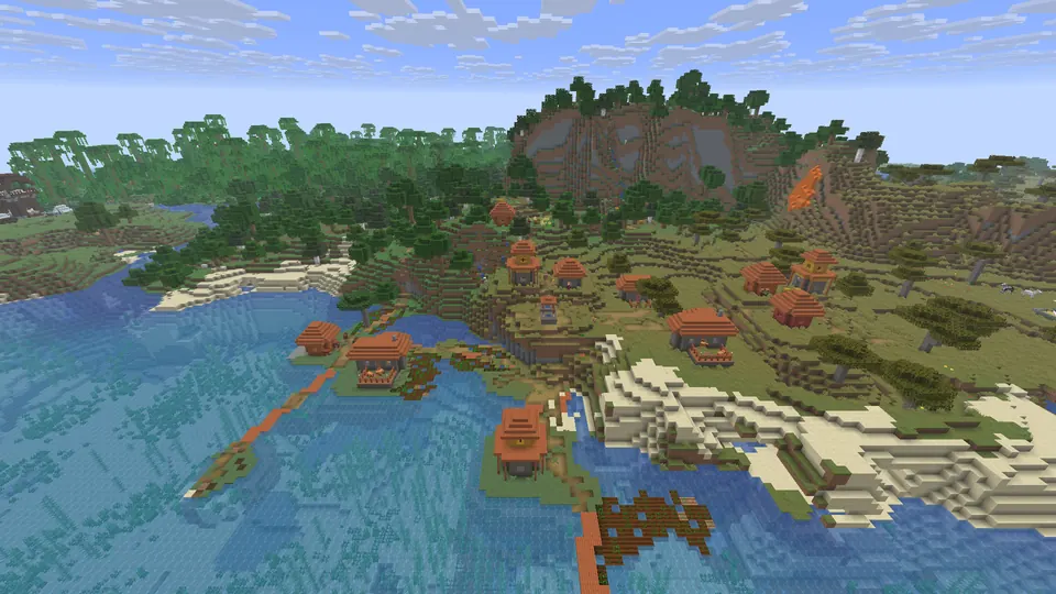 Orange-roofed village houses on a green hillside by the sea, some on a small island joined by wooden walkways